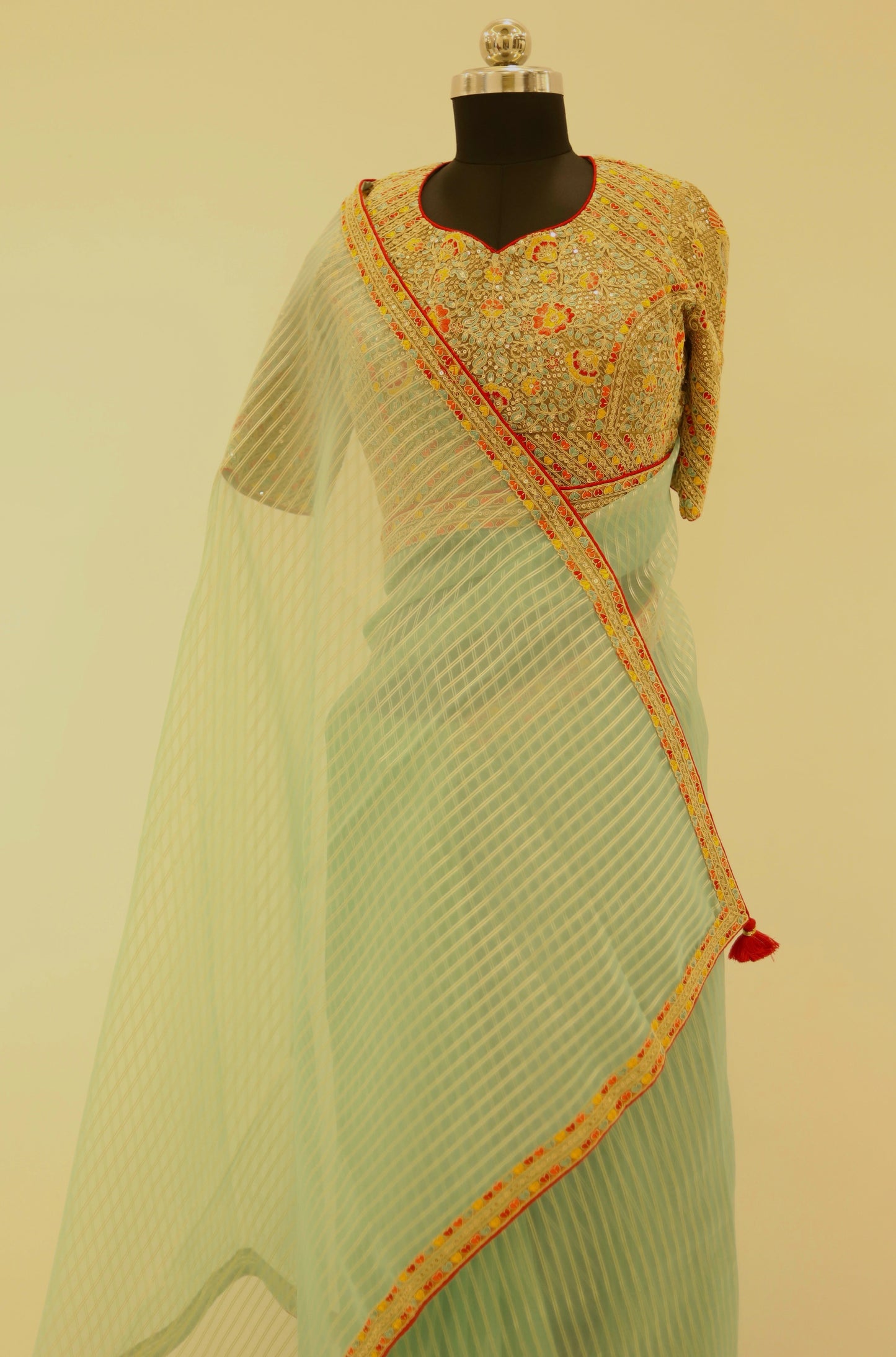 Sea Blue Tissue Saree paired with zari readymade blouse