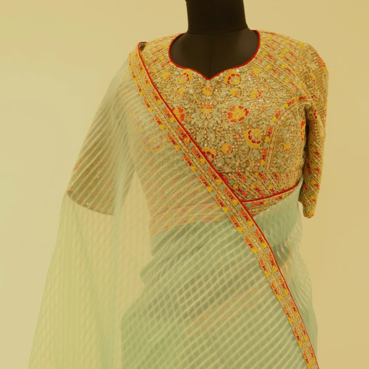 Sea Blue Tissue Saree paired with zari readymade blouse