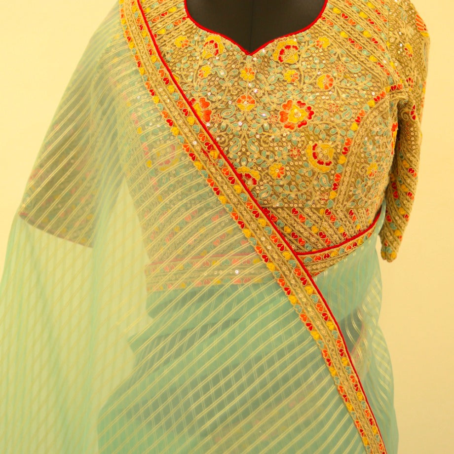 Sea Blue Tissue Saree paired with zari readymade blouse