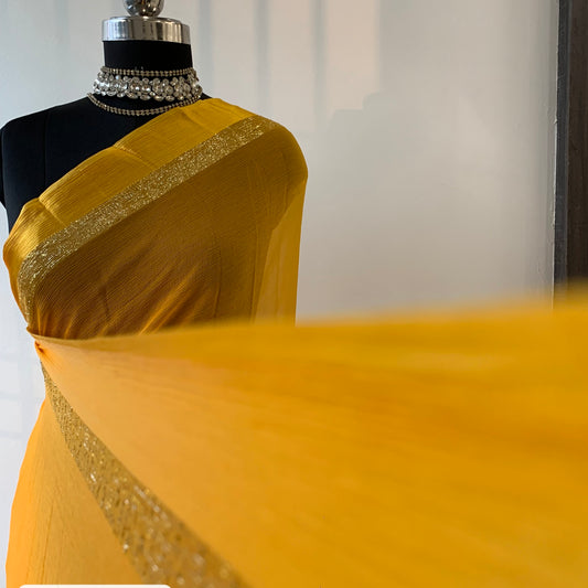 Yellow chiffon saree with resham embroidery