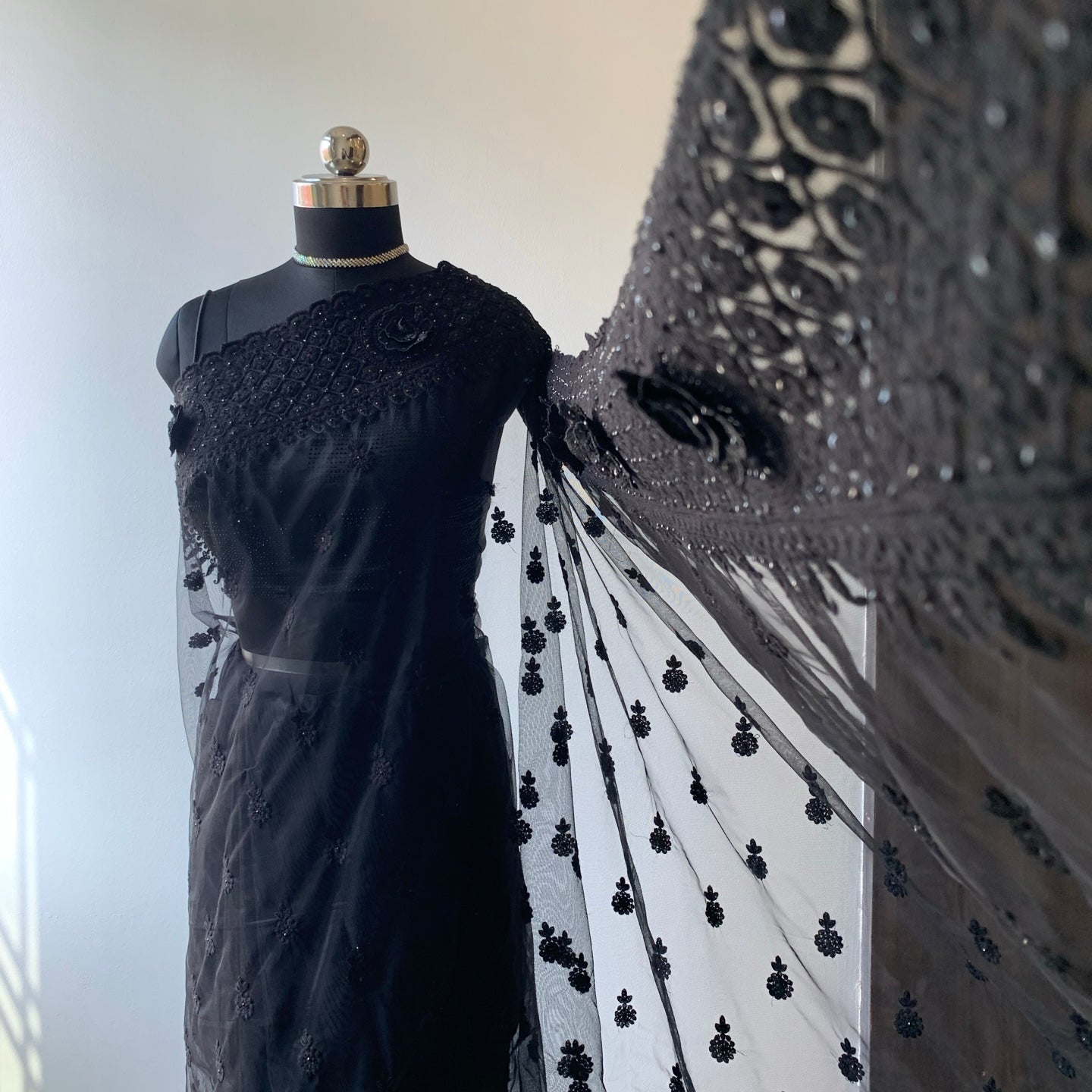 Black Net Saree With Floral Threadwork And Unstitched Blouse Piece